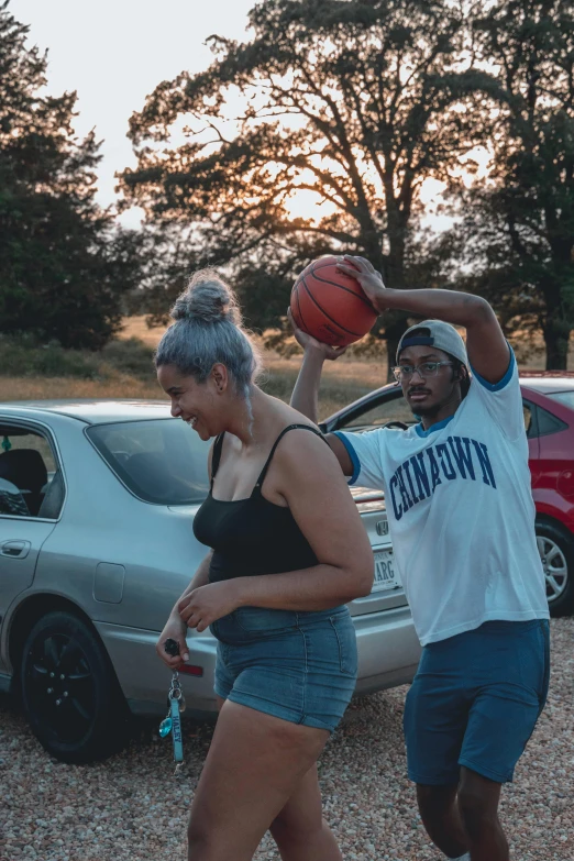 a couple of people playing a game of basketball, an album cover, pexels contest winner, happening, cars and people, college party, low quality, alana fletcher