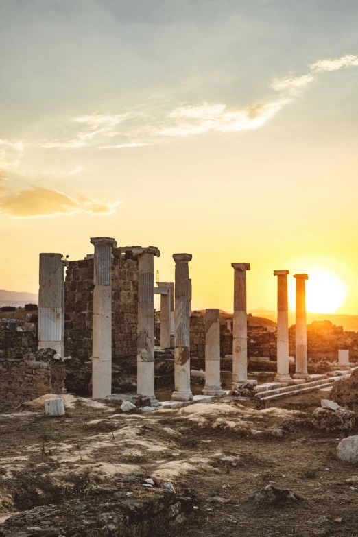 the sun is setting over the ruins of the ancient city, pexels contest winner, neoclassicism, marble white columns, burned, mediterranean island scenery, instagram post