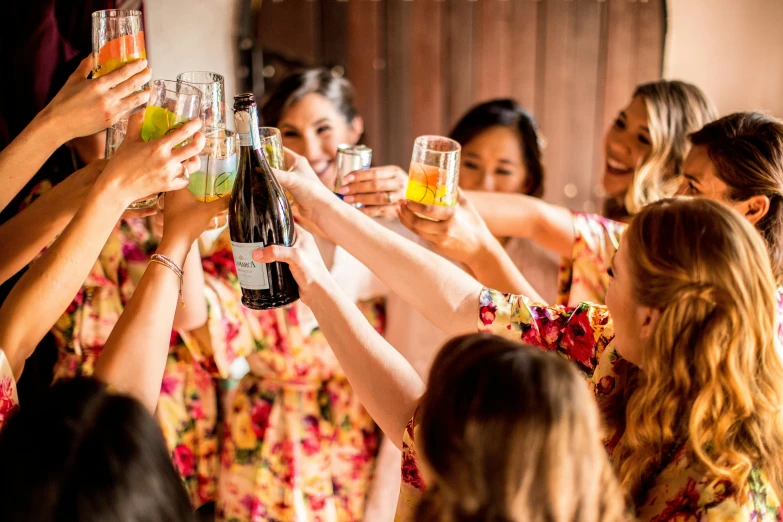 a group of women standing next to each other holding glasses, by Nicolette Macnamara, pexels contest winner, happening, bubbly, floral, holding a bottle, patterned