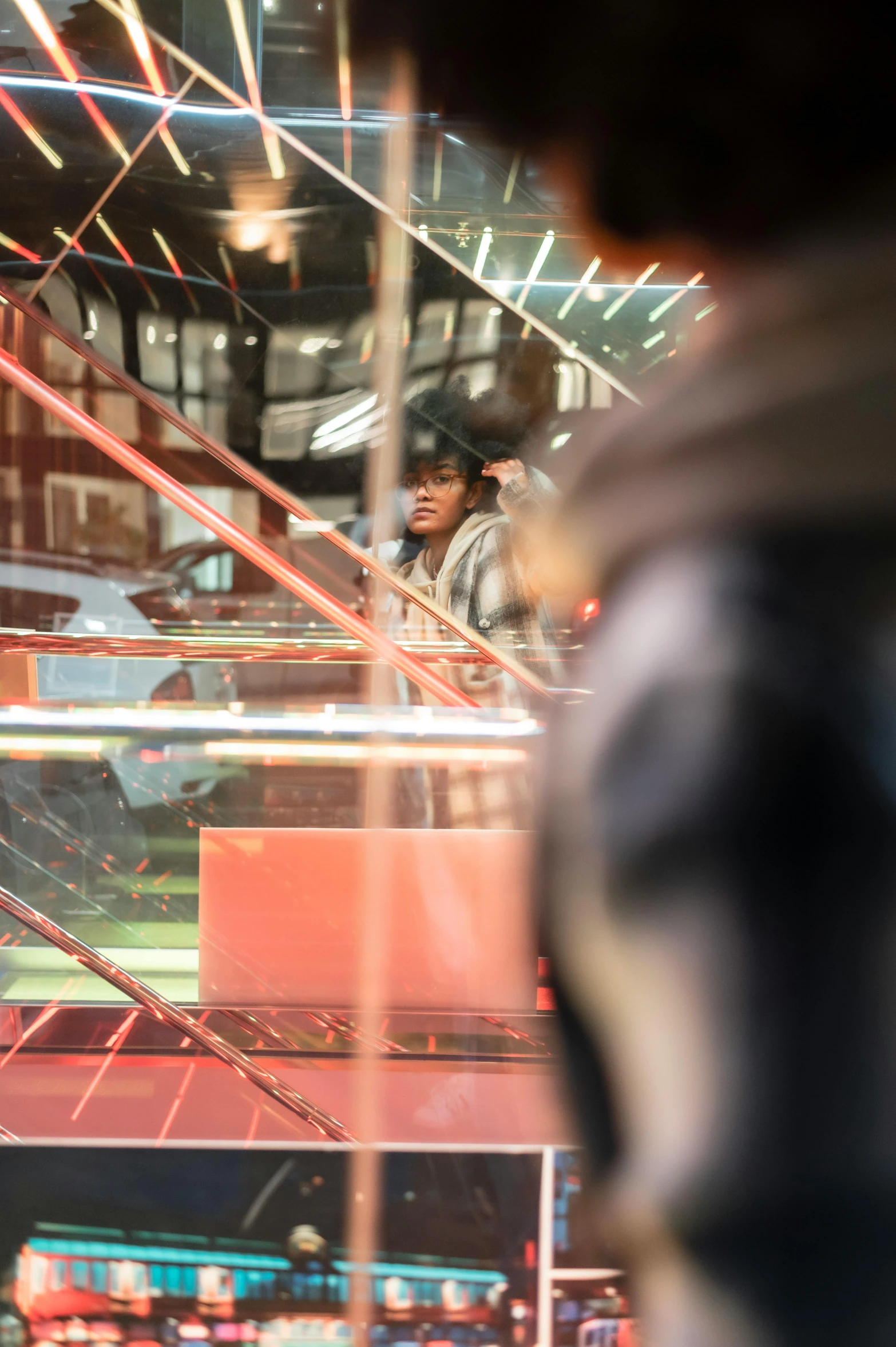 a man that is standing in front of a window, a digital rendering, by Lisa Nankivil, trending on unsplash, happening, a busy arcade, high reflections, miles morales, f1.8 anamorphic