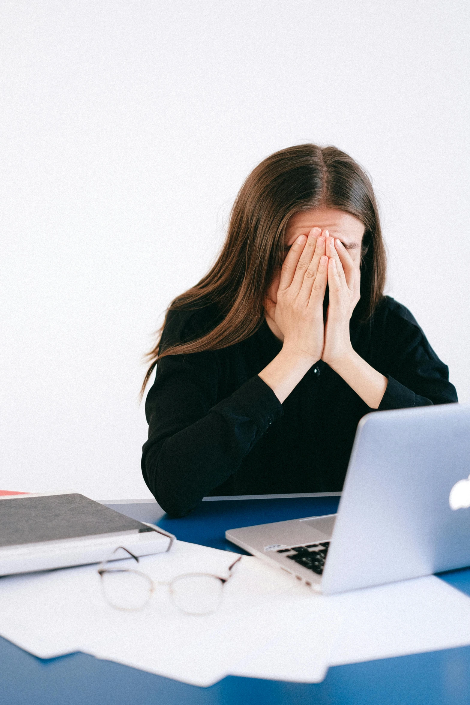 a woman sitting at a desk with her hands on her face, hypermodernism, broken laptop screen, instagram post, distraught, taken in the late 2010s