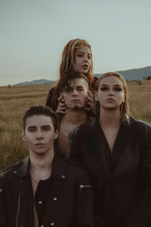 a group of people standing in a field, an album cover, unsplash contest winner, antipodeans, model pose, slick hair, hollywood promotional image, riverdale