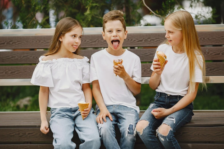 three children sitting on a bench eating donuts, by Lee Loughridge, pexels, earing a shirt laughing, ice cream cone, 6 pack, excited russians