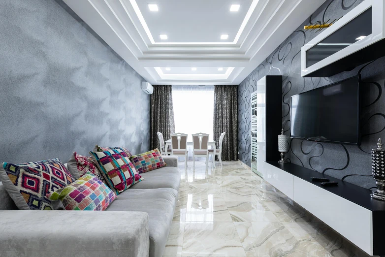 a living room filled with furniture and a flat screen tv, inspired by Farid Mansour, pexels contest winner, shiny marble floor, white and silver, vibrant aesthetic, floor tiles