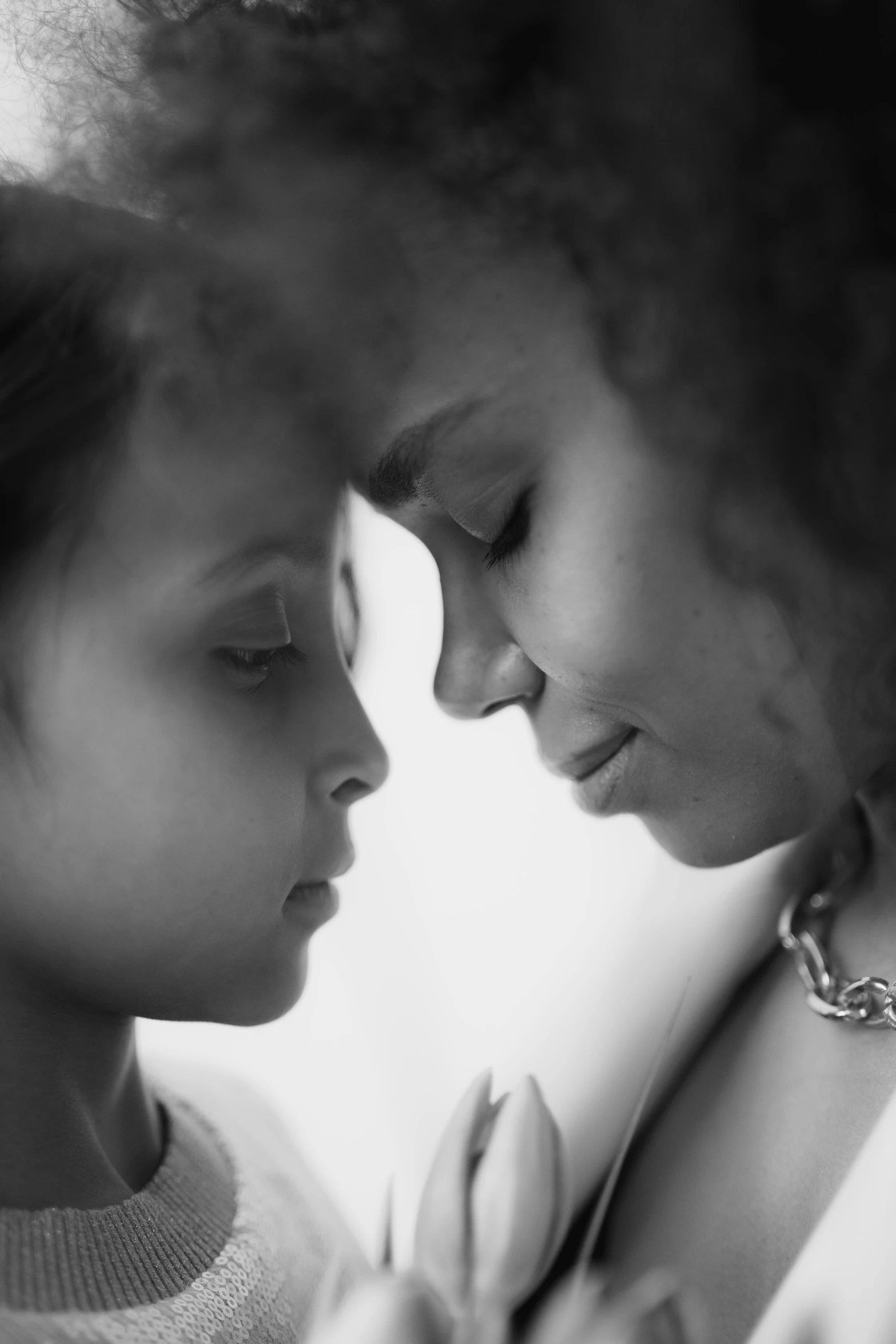 a black and white photo of a mother and daughter, inspired by Carrie Mae Weems, realism, 15081959 21121991 01012000 4k, lovely kiss, ashteroth, ((portrait))