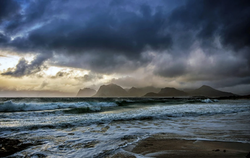 a large body of water under a cloudy sky, by Roar Kjernstad, pexels contest winner, romanticism, stormy coast, morning, costa blanca, skye meaker