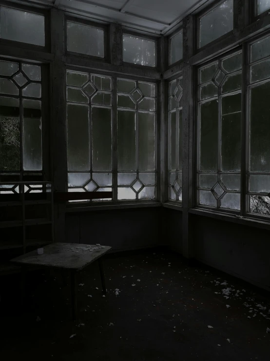 a dark room with lots of windows and a bench, an album cover, tonalism, broken windows, snapchat photo, glass room, hiroyuki kato