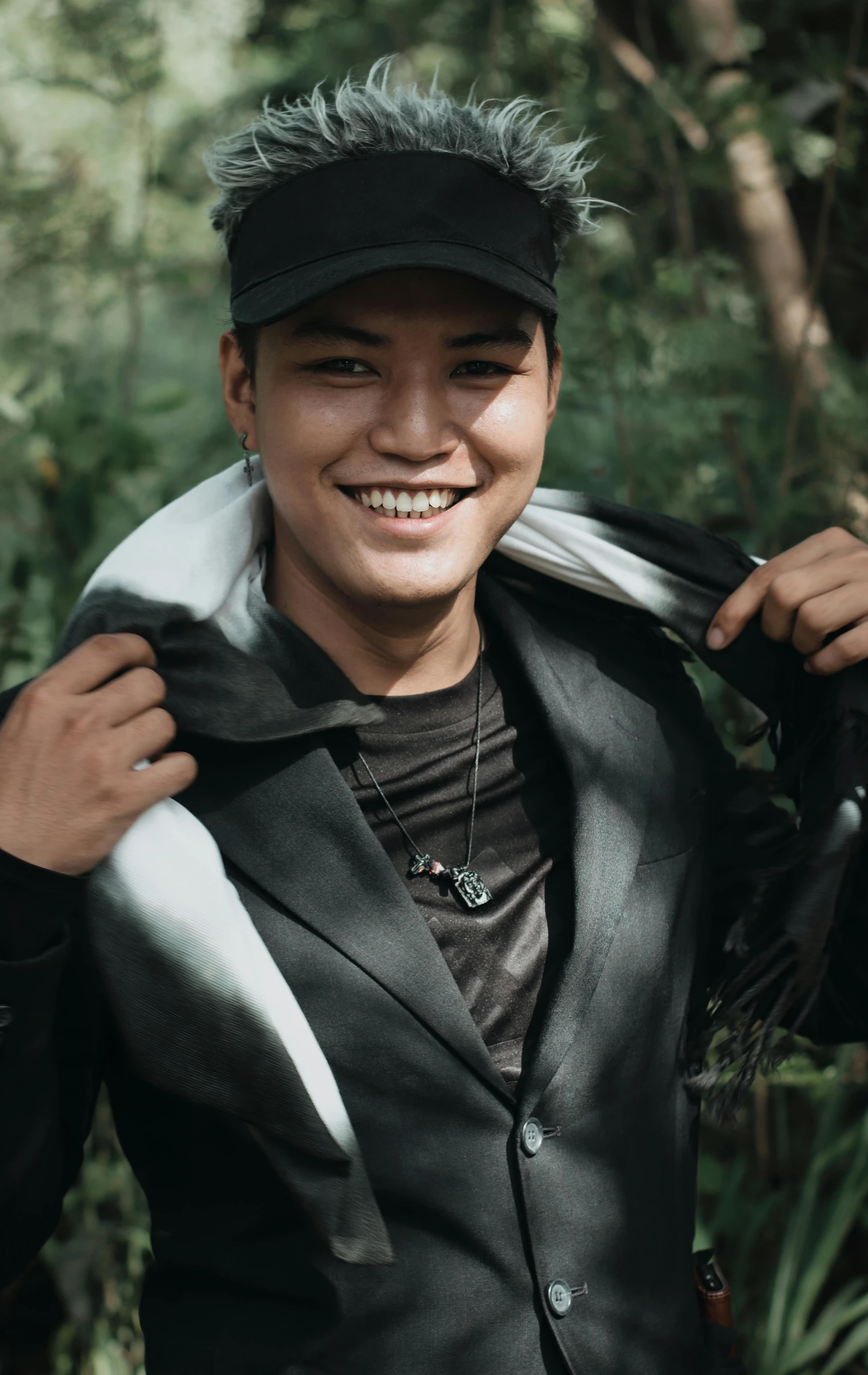 a man in a leather jacket posing for a picture, unsplash, sumatraism, with black, androgyny, avatar image, nature photo