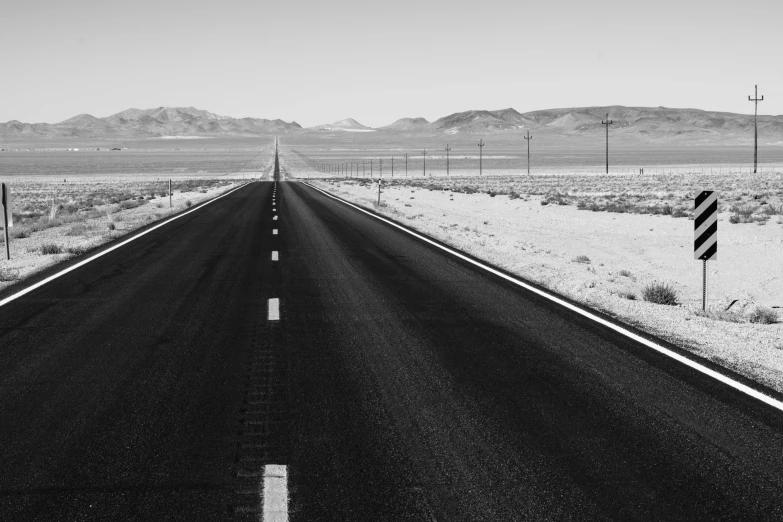 a black and white photo of an empty road, unsplash, road california desert, 🚿🗝📝, black and white paint, heavy lines