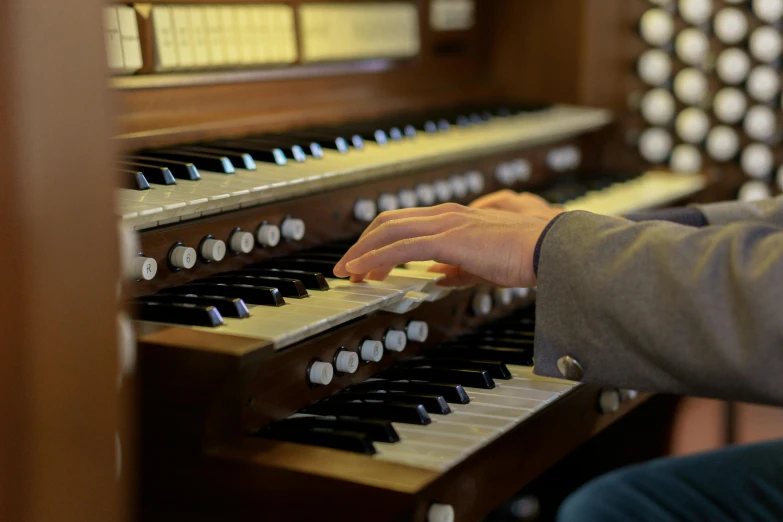 a close up of a person playing a pipe organ, profile image, closed hands, caparisons, thumbnail