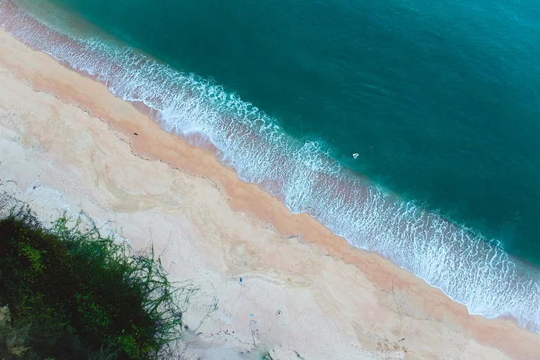 a large body of water next to a sandy beach, by Carey Morris, pexels contest winner, hurufiyya, flat lay, cliffside, digitally enhanced, teaser