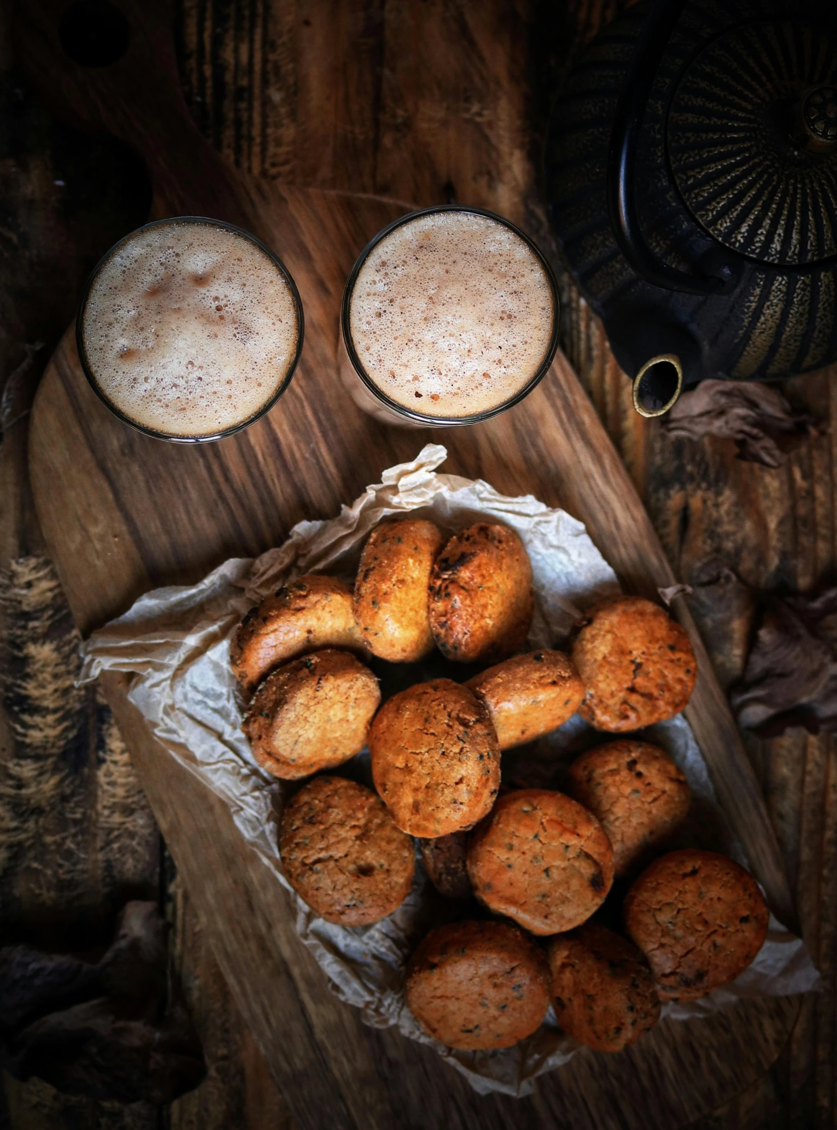 a plate of cookies sitting on top of a wooden table, by Jan Tengnagel, hurufiyya, medium format. soft light, beer, thumbnail, autum