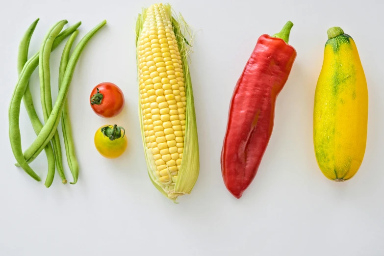 a variety of vegetables laid out on a white surface, pexels, corn, background image, teaser, unedited