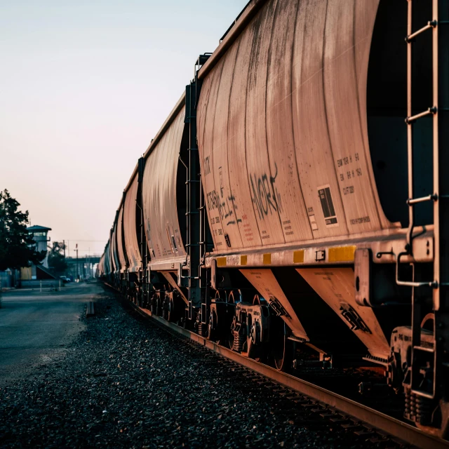 a large long train on a steel track, by Brad Holland, pexels contest winner, 🚿🗝📝, instagram story, plain background, early evening