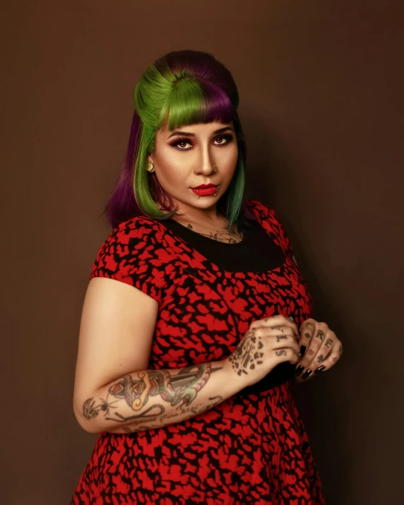 a woman with green hair wearing a red and black dress, trending on pexels, toyism, malaysian, queer woman, retro style ”, prideful look