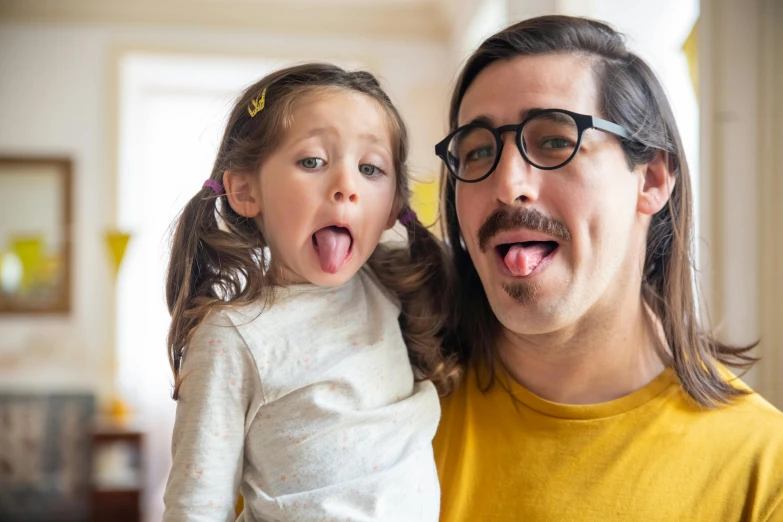 a man and a little girl sticking out their tongues, inspired by Leo Leuppi, pexels contest winner, john oliver and adam driver, hipster dad, avatar image, tiny thin mustache