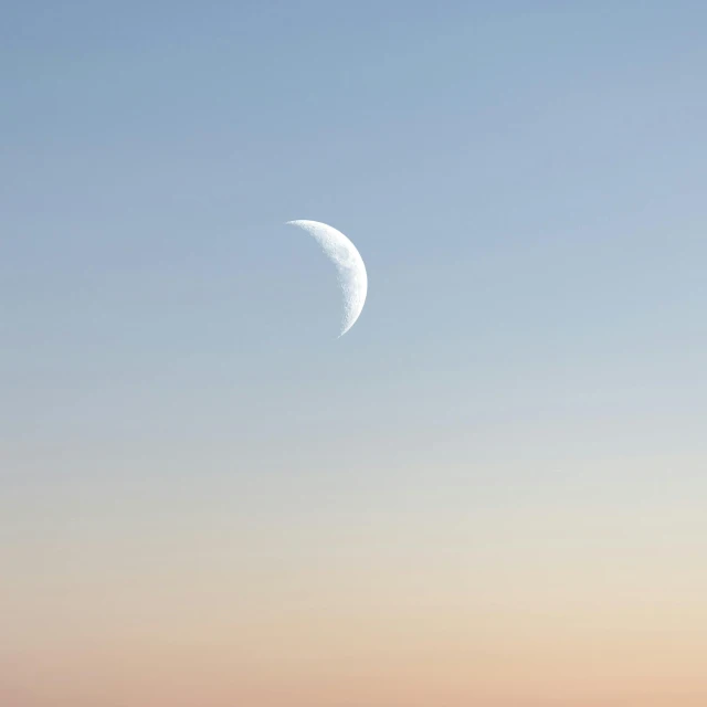 a half moon in the sky over a body of water, by Niko Henrichon, trending on unsplash, minimalism, cloudless-crear-sky, muted colours 8 k, crescent moon, early dawn