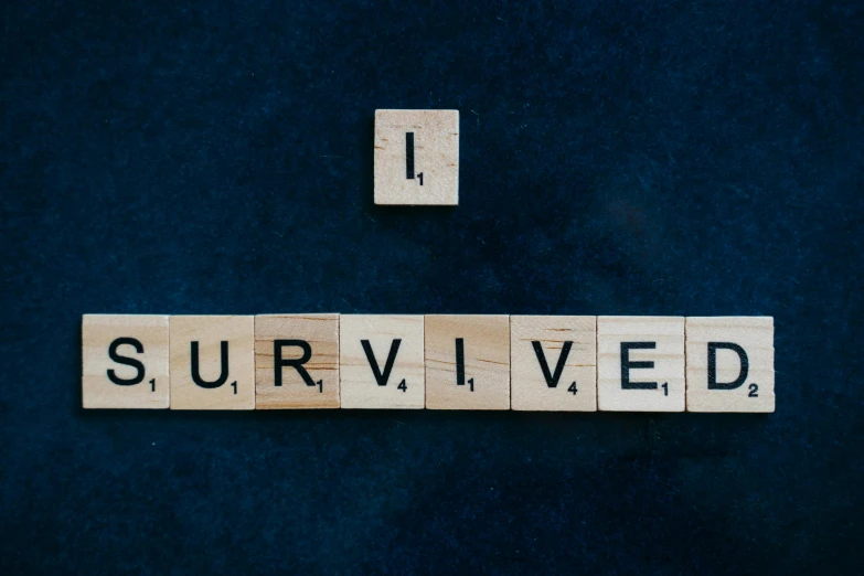 scrabbles spelling i survived on a blue background, inspired by Paul Harvey, pexels contest winner, hurufiyya, physical : tinyest midriff ever, with a black background, ark survival, curated collections