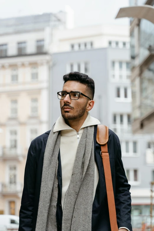 a man in glasses is walking down the street, trending on pexels, non binary model, muslim, tall handsome guys, munich