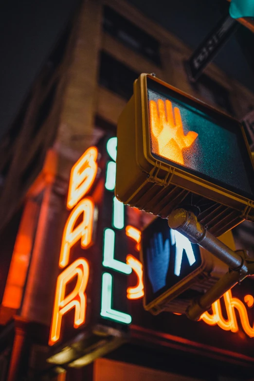 a traffic light hanging from the side of a building, an album cover, by Chris Rallis, unsplash, happening, glowing hands, old signs, nightclub, surveillance footage