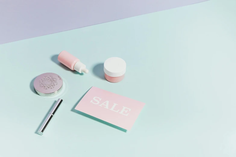 a pink sale sign sitting on top of a blue table, a still life, white powder makeup, thumbnail, pastel green, overview