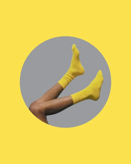 the legs of a person wearing yellow socks, an album cover, trending on unsplash, antipodeans, pose(arms up + happy), non-binary, profile image, banner