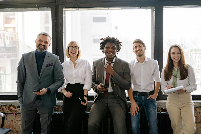 a group of people standing next to each other, in an office, promo image, background image, diverse outfits