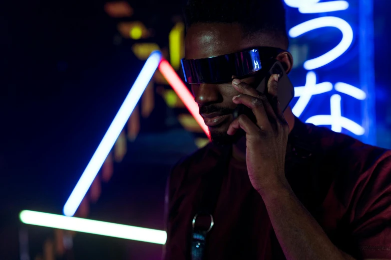 a man in a red shirt talking on a cell phone, pexels, afrofuturism, black neon lights, wearing shades, teddy fresh, posing in dramatic lighting
