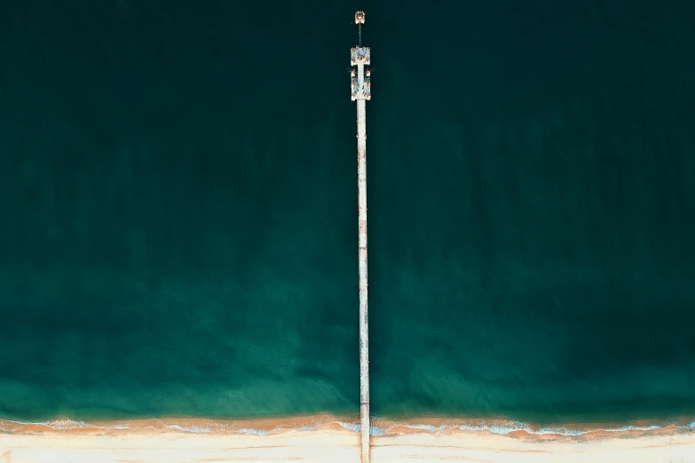 a large body of water next to a beach, by Peter Churcher, unsplash contest winner, minimalism, standing on the mast, 15081959 21121991 01012000 4k, streetlight, satellite view