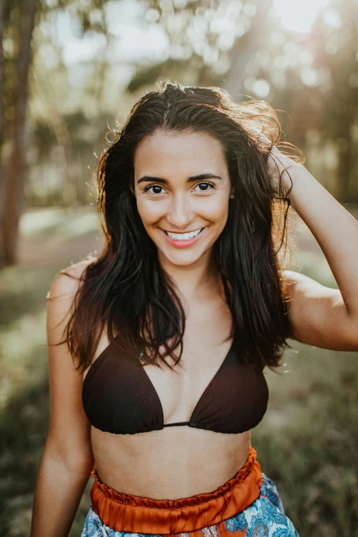 a woman in a bikini top posing for a picture, fair olive skin, serene smile, bright and moody, instagram photo