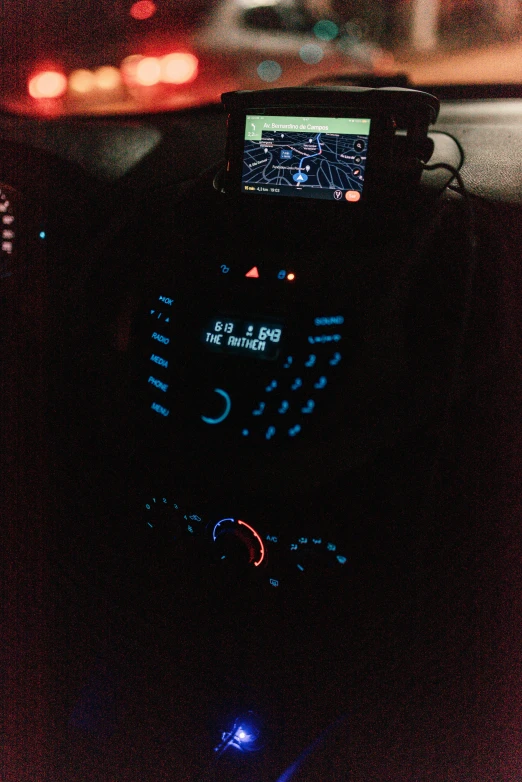 a view of the dashboard of a car at night, reddit, usb ports, holding a very advance phone, 2 5 6 x 2 5 6 pixels, adafruit