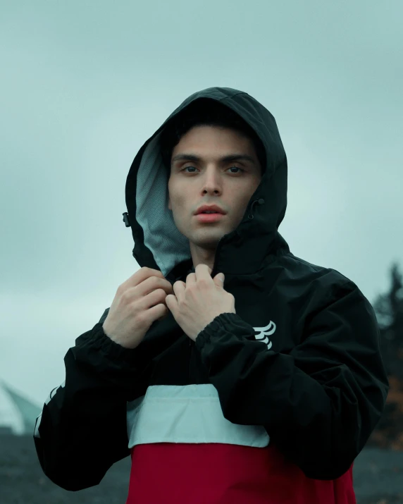 a man in a red and white hoodie, unsplash, wearing a black jacket, nonbinary model, ethan klein, 8k octan photo