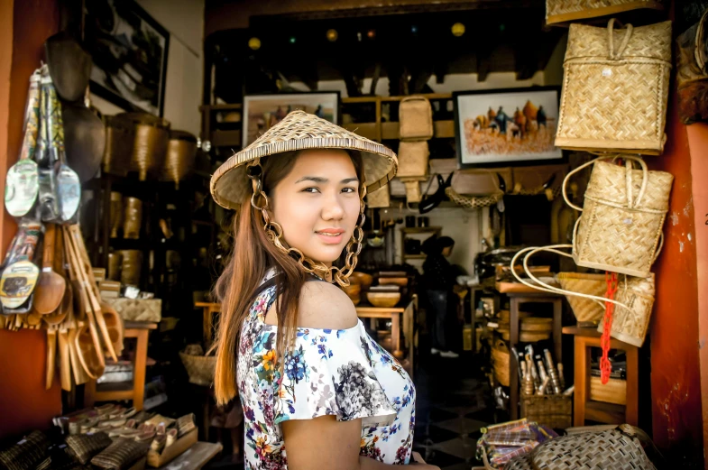 a woman wearing a straw hat in a shop, a portrait, pexels contest winner, avatar image, ancient city streets behind her, bangkuart, 🐝👗👾