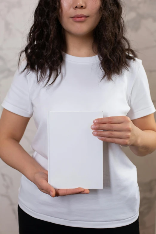 a woman holding a white box in her hands, an album cover, pexels contest winner, private press, plain white tshirt, vertical orientation, whole card, product introduction photo