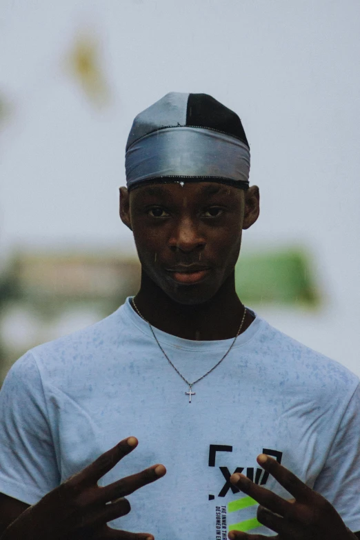 a man holding a tennis racquet in one hand and a tennis ball in the other, an album cover, by Charles Martin, pexels contest winner, hyperrealism, wearing a chocker and cute hat, adut akech, headshot profile picture, lo fi