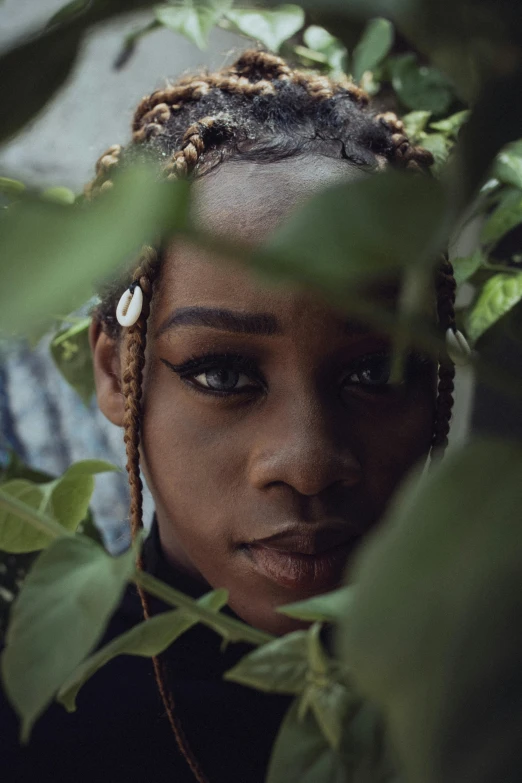 a close up of a person in a tree, an album cover, trending on unsplash, afrofuturism, portrait androgynous girl, lush foliage, ( ( dark skin ) ), portrait shot 8 k