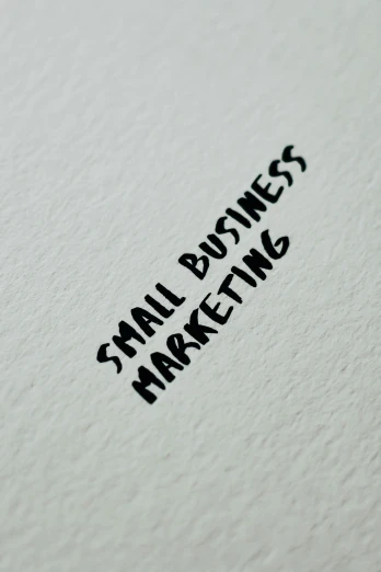 a close up of a piece of paper with the words small business marketing written on it, by Sam Dillemans, pixabay, r / paintedminis, very grainy image, square, very very low quality picture