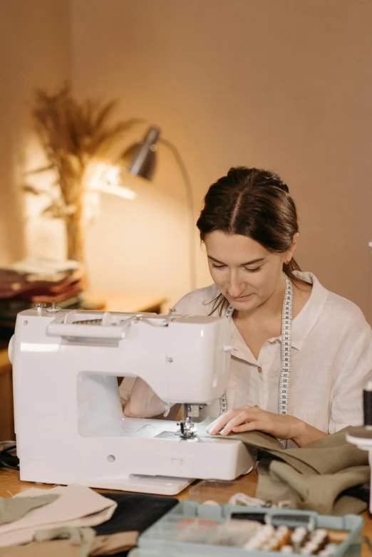 a woman is working on a sewing machine, by Grace English, trending on pexels, made of fabric, high quality portrait, thumbnail