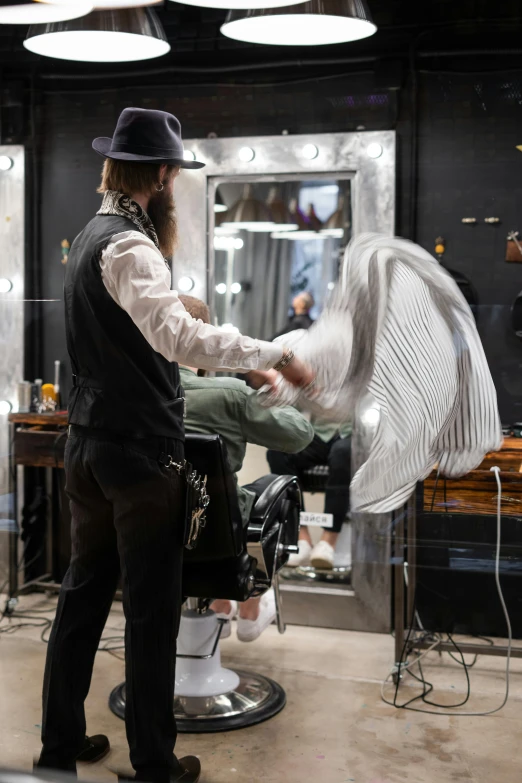 a man getting a haircut at a barber shop, by Adam Saks, pexels contest winner, huge feathery wings, hammershøi, practical effects, thumbnail