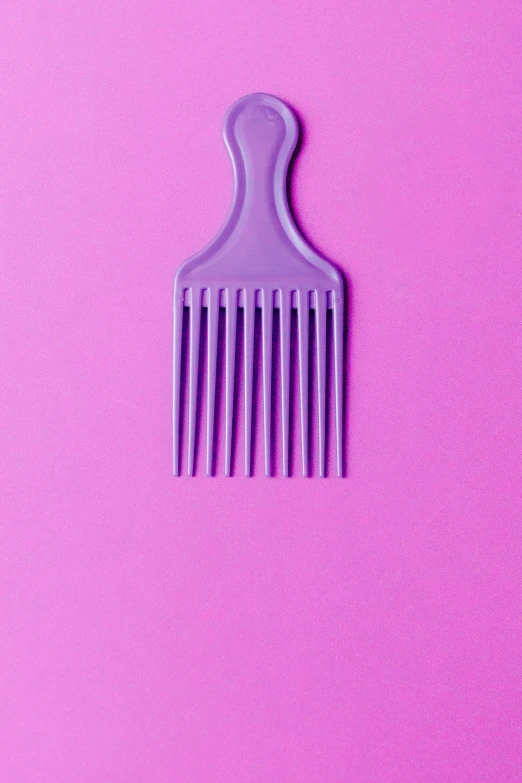 a purple comb sitting on top of a pink surface, by Doug Ohlson, trending on pexels, plasticien, african american, using fork, large tall, ilustration