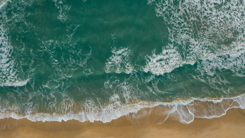 a person riding a surfboard on top of a sandy beach, pexels contest winner, renaissance, view from above on seascape, rippling electromagnetic, 4k hd wallpaper:4, teal aesthetic