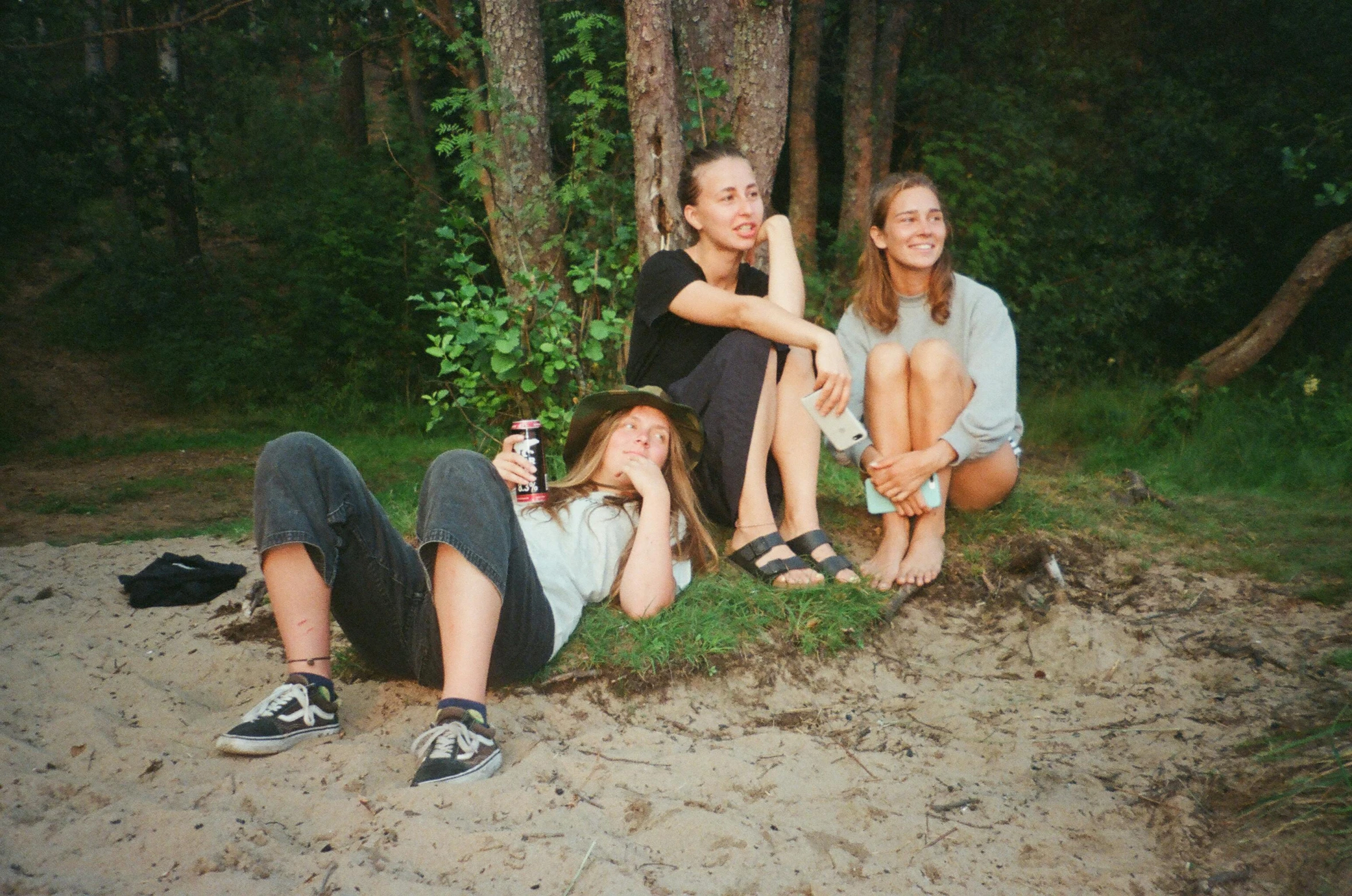 a group of young women sitting next to each other, a picture, by Maud Naftel, unsplash, vhs style, camping, with wet faces!!, three women