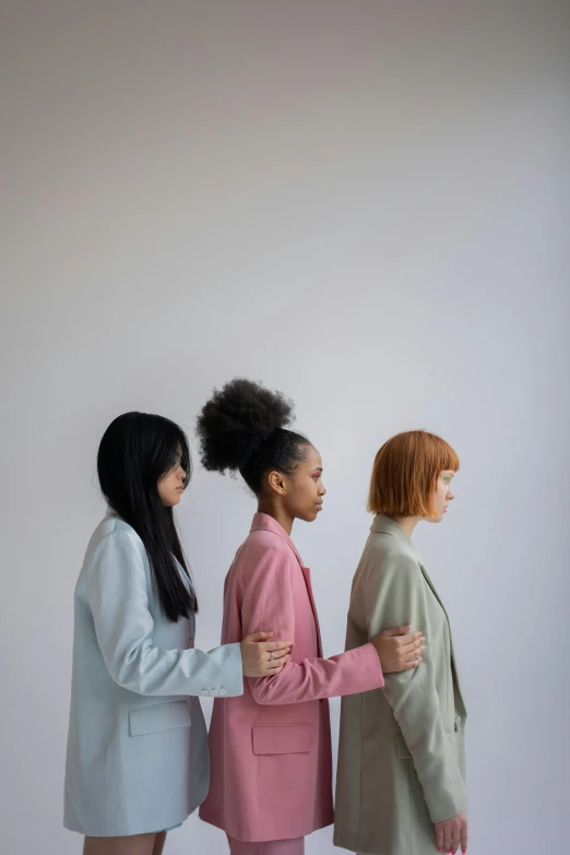 a group of three women standing next to each other, trending on pexels, muted arm colors, head turned, ignant, mixed race woman