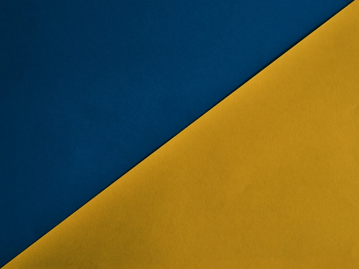 a close up of a yellow and blue wall, unsplash, angular minimalism, midnight blue, two - tone, ocher