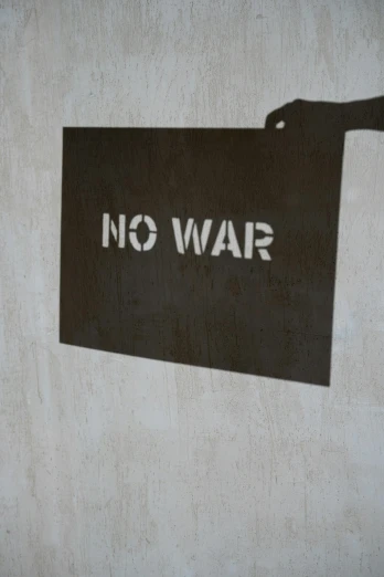 a sign that says no war on a wall, by Leon Polk Smith, negative space, promo image, 3 0, combat