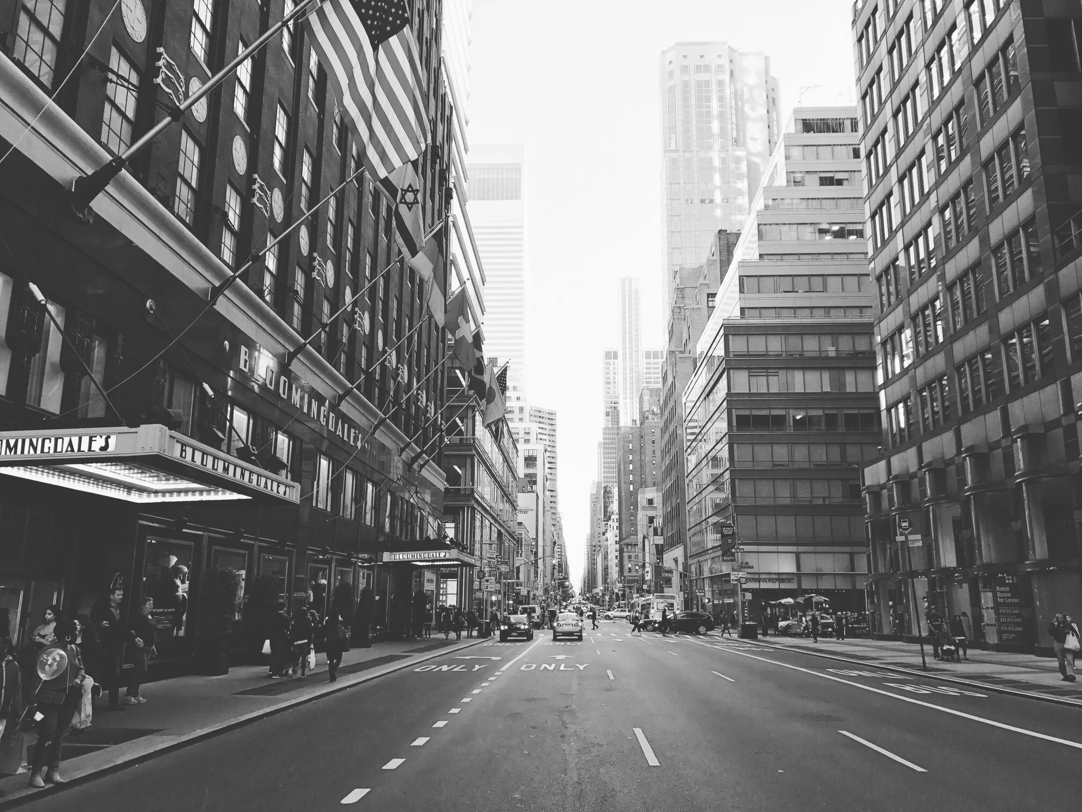 a black and white photo of a city street, pexels, manhattan, clean streets, 🌸 🌼 💮, empty streetscapes