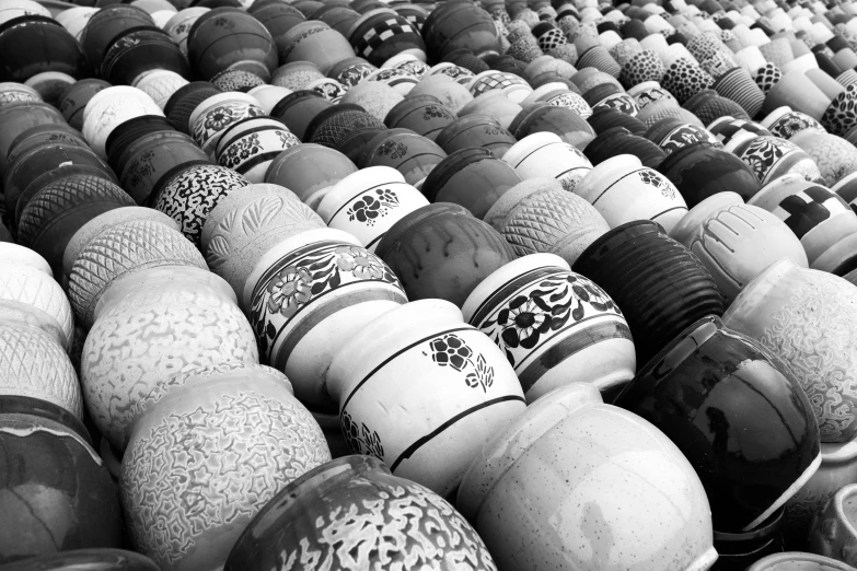 a bunch of vases sitting next to each other, a black and white photo, by Ai Weiwei, flickr, cloisonnism, the vibrant echoes of the market, round shapes, moroccan, 64x64