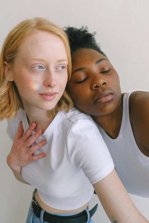 a couple of women standing next to each other, by Carey Morris, trending on pexels, renaissance, albino white pale skin, kara walker james jean, lesbian embrace, dressed in a white t shirt