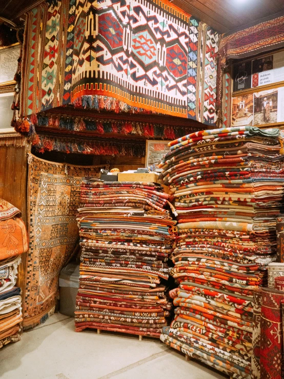 a room filled with lots of different types of rugs, istanbul, gif, thumbnail, stacked