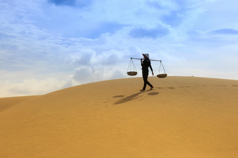 a person walking on top of a sand dune, metal scales, carrying a tray, avatar image